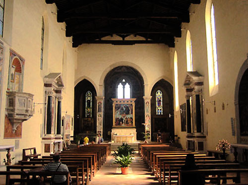 The nave of the church, with the Gozzoli frescoes in the distance.