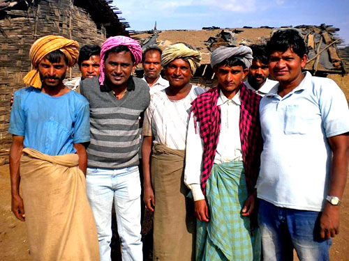 An Augustinian (second from left) visits a village in Central India