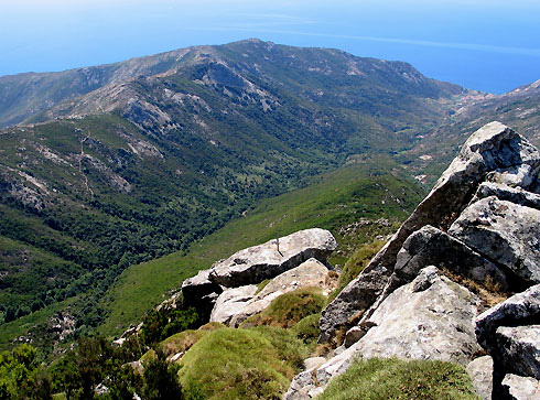 The rugged costal edge of Tuscany, photographed from Monte Capanne and showing the Pomonte Valley.