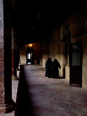 Two Augustinian nuns in the Lecceto community, returning from chapel