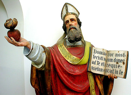 Wooden statue of St Augustine near his tomb at Pavia.