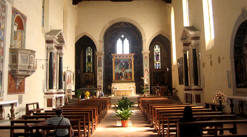 San Gimignano church interior, with Gozzoli frescoes around the altar