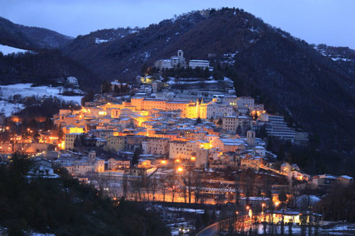 Cascia at night; Rita's Church and Shrine halfway up the right edge.