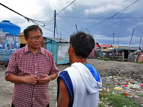 Augustinian (al left) ministering in the Philippines