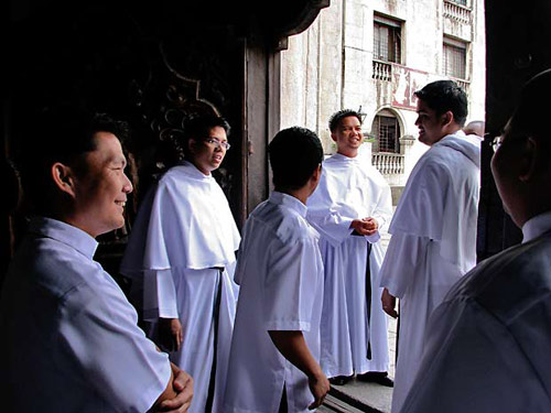 Young Augustinians at the San Agustin church door at Intramuros, Manila.