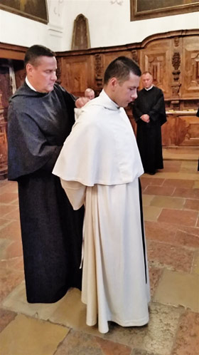 Receiving the Augustinian white habit.