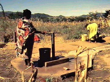 Drawing water from a well in Africa