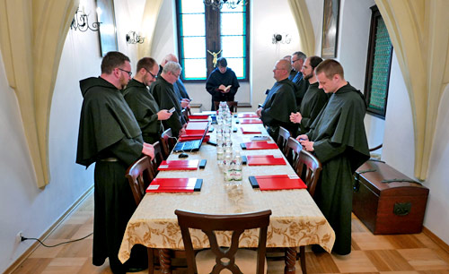 A Polish Augustinian community prays before a meeting
